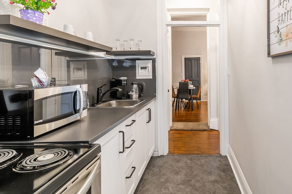 Fully Equipped Kitchen Flowing Into The Dining Area