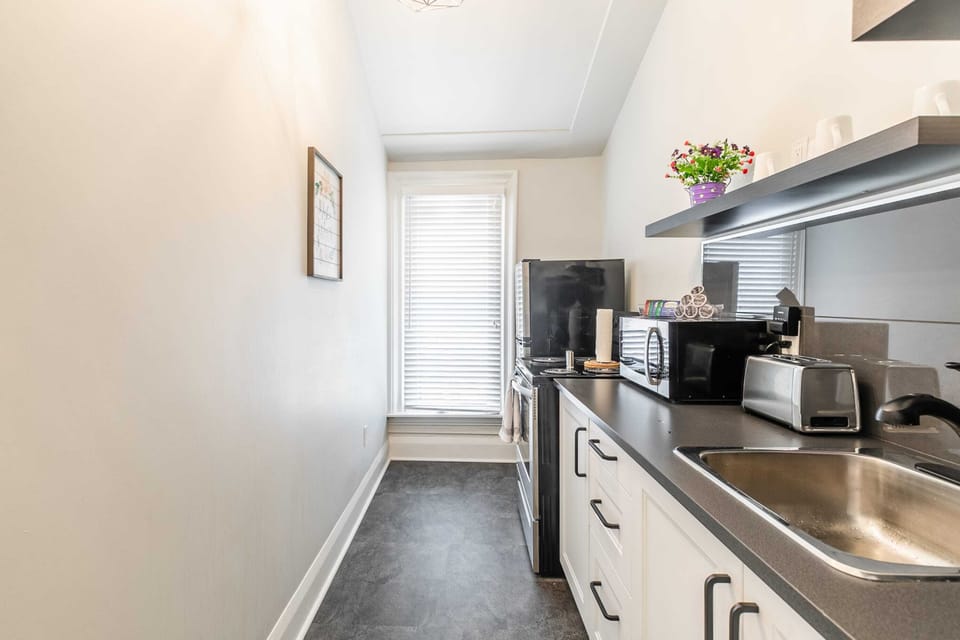 Bright Kitchen With Modern Amenities And Natural Light