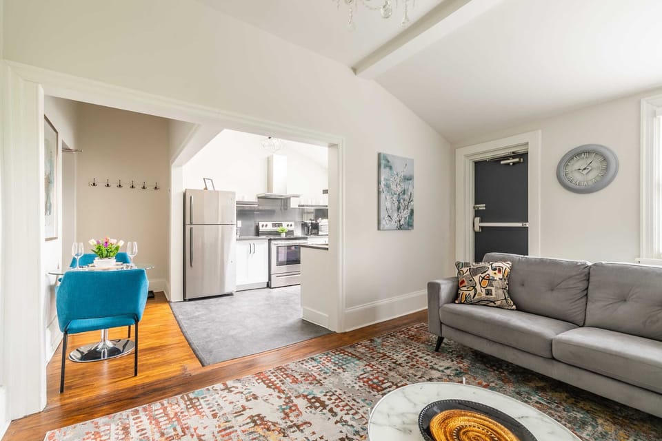 Open Concept Living Area With Modern Kitchen And Cozy Seating