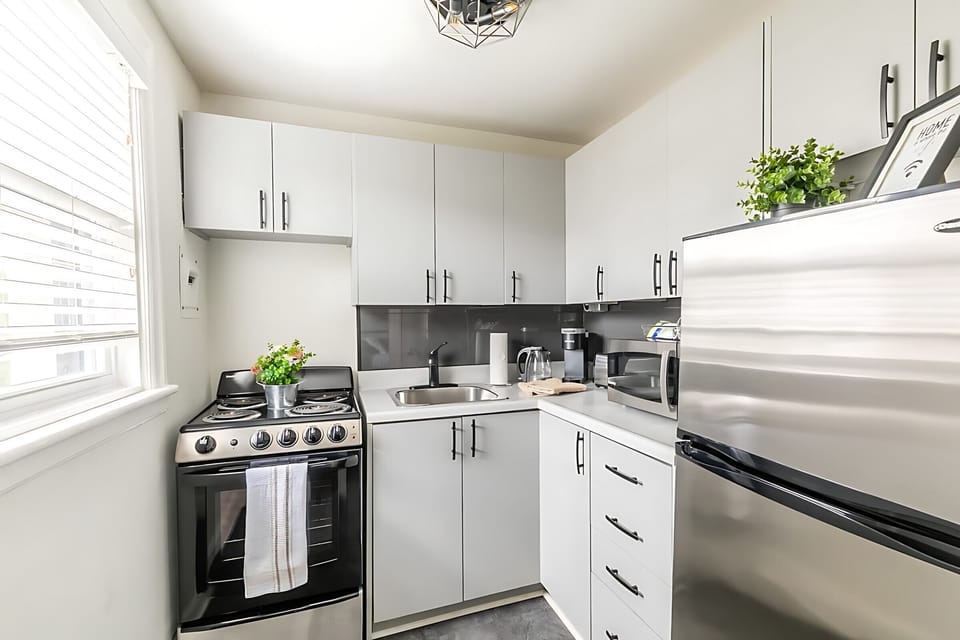 Fully Equipped Kitchen Featuring Stylish Details And Ample Storage