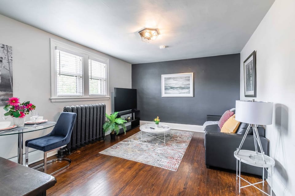 Spacious Living Room With Modern Decor And A Large Smart TV