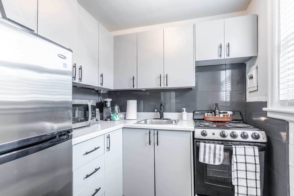 Fully Equipped Kitchen With Stylish Cabinets And Counter Space