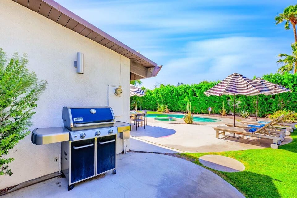 Nestled on the side of the house is a BBQ grill -perfect for family gathering over chill nights. 