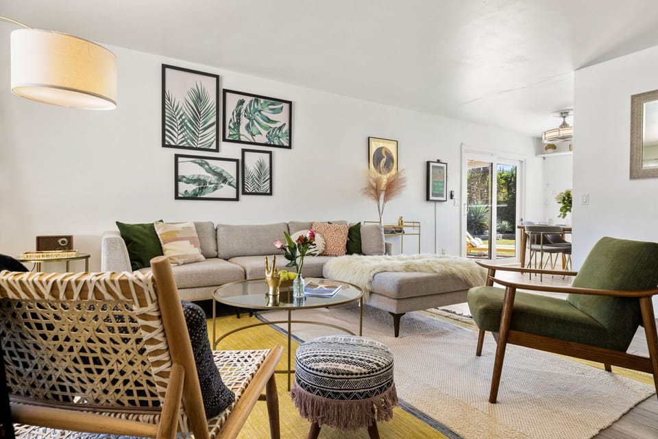 Experience seamless living in this open-concept space, where modern design meets comfort in the living and dining areas