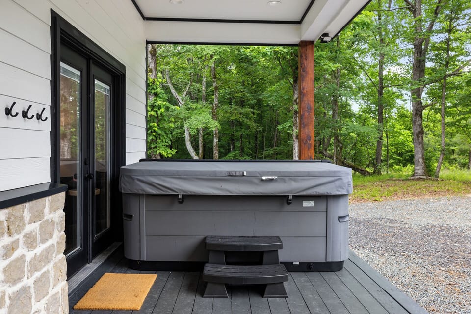 Hot Tub Oasis: Unwind in your private hot tub surrounded by lush greenery and fresh air!