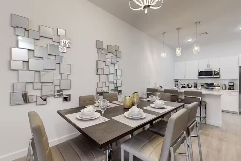 Dine in style at the spacious table, perfect for meals with family or friends.