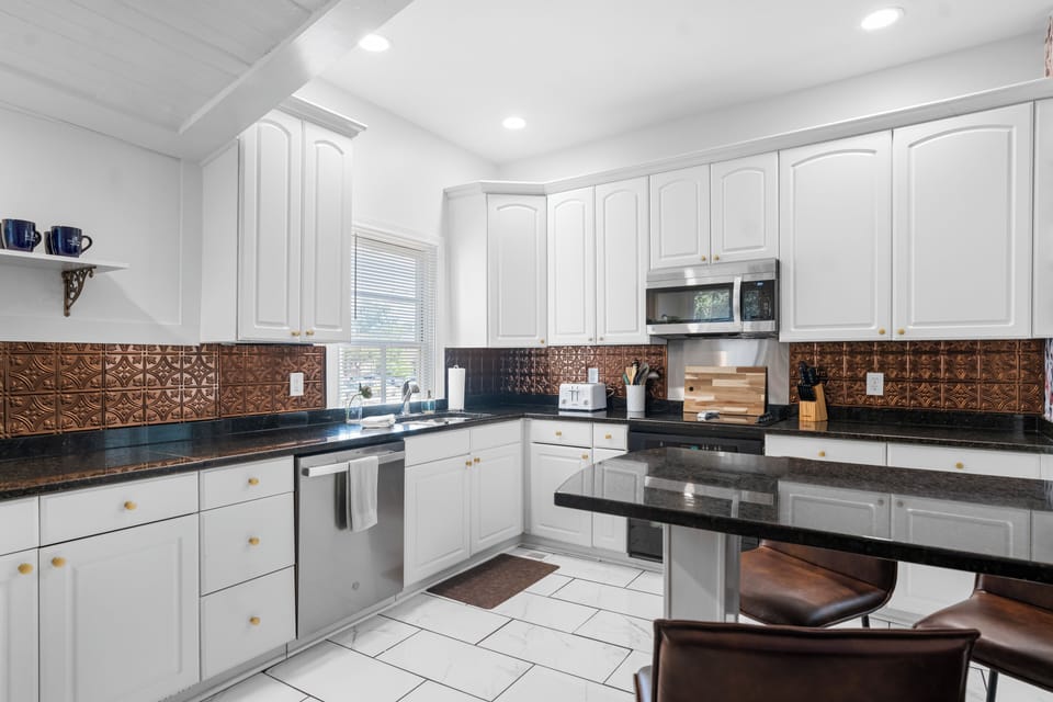 Dishwasher, cooktop, range, microwave and refrigerator.  