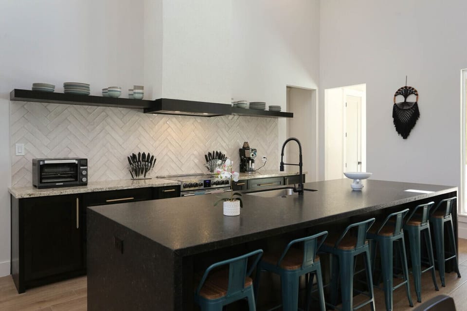 Discover the heart of the home in this fully equipped kitchen with a large island for six, perfect for cooking and gathering with family and friends.