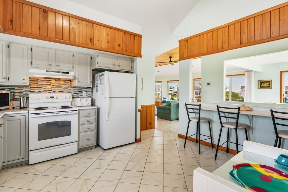 The fully equipped Kitchen includes and a pantry and a breakfast bar with seating for 3.