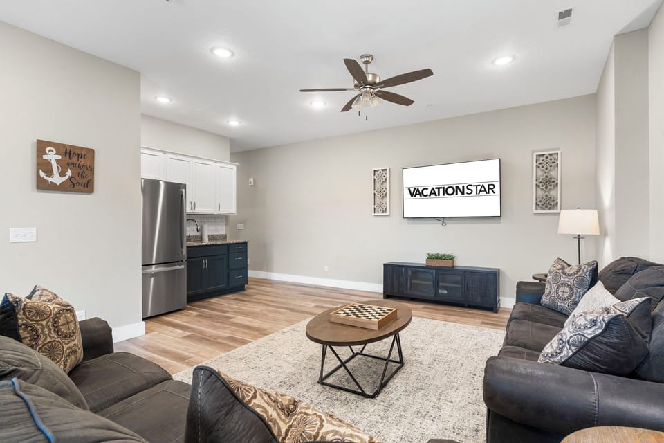 Downstairs Living Area with a Wet Bar, Lower Patio Access, and more!