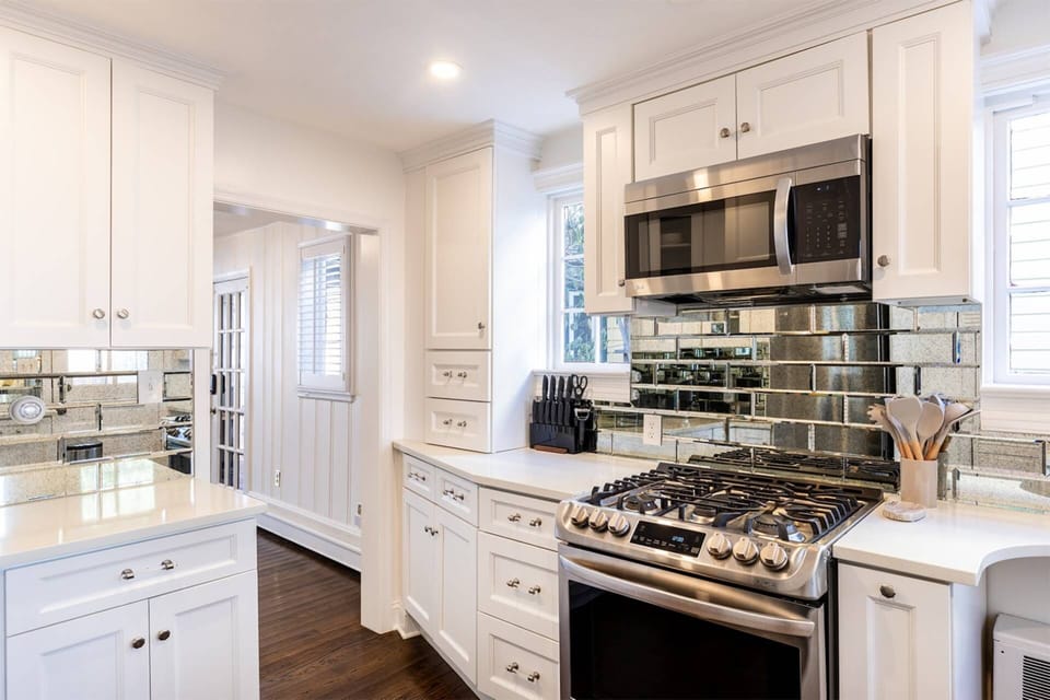 The mirrored European backsplash is a unique feature to the kitchen.