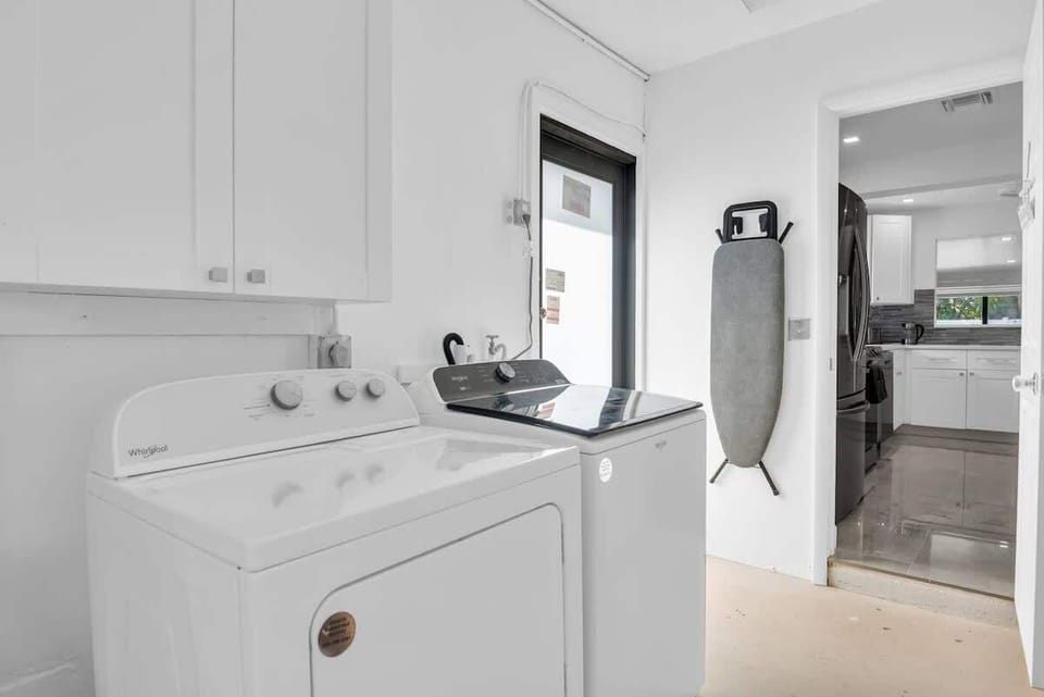 This bright and airy room features a modern washer and dryer, making it easy to keep your wardrobe fresh during your stay.
