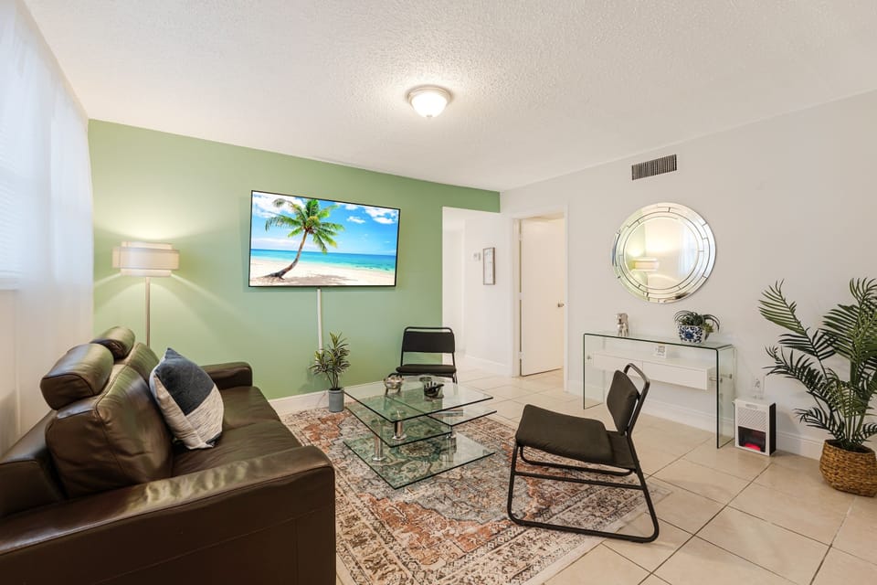 Enjoy a bright and airy living room with a comfortable sofa, smart TV, and high-speed Wi-Fi. Unwind while enjoying your favorite shows