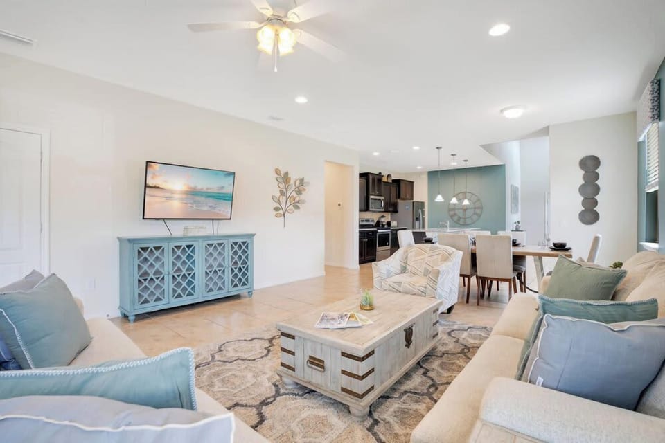Open-concept living area with coastal-inspired decor and comfortable seating.