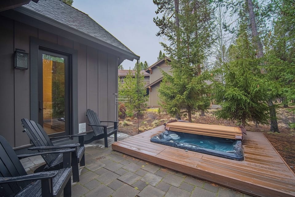 Soak in your private hot tub on this stunning cedar deck, surrounded by towering evergreens in this peaceful forest retreat.