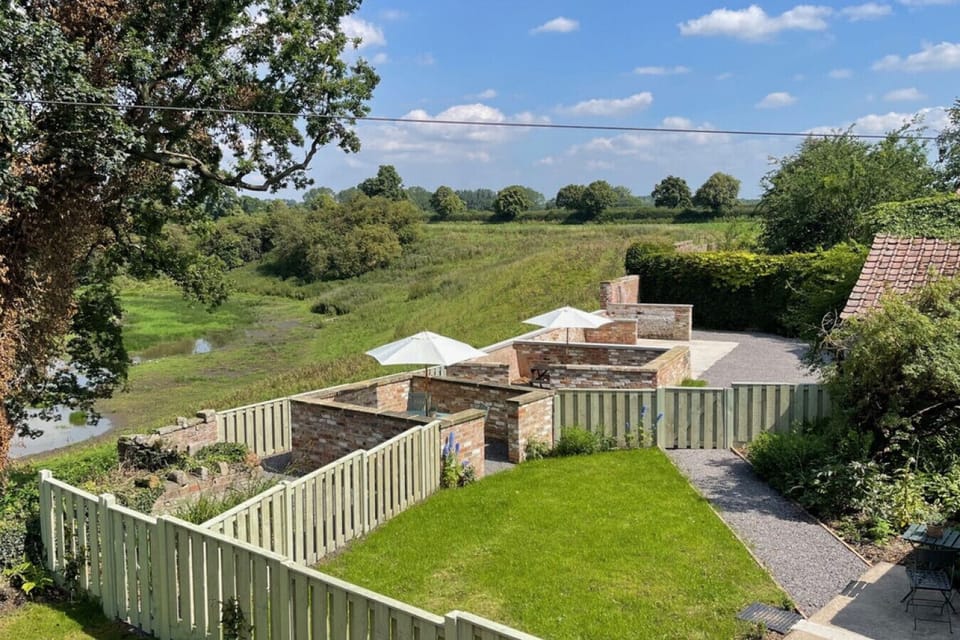 Tranquil adjoining gardens with views of the Yorkshire Dales at Givendale Holiday Cottages, a perfect spot to unwind surrounded by natural beauty in the Yorkshire Dales near Ripon.