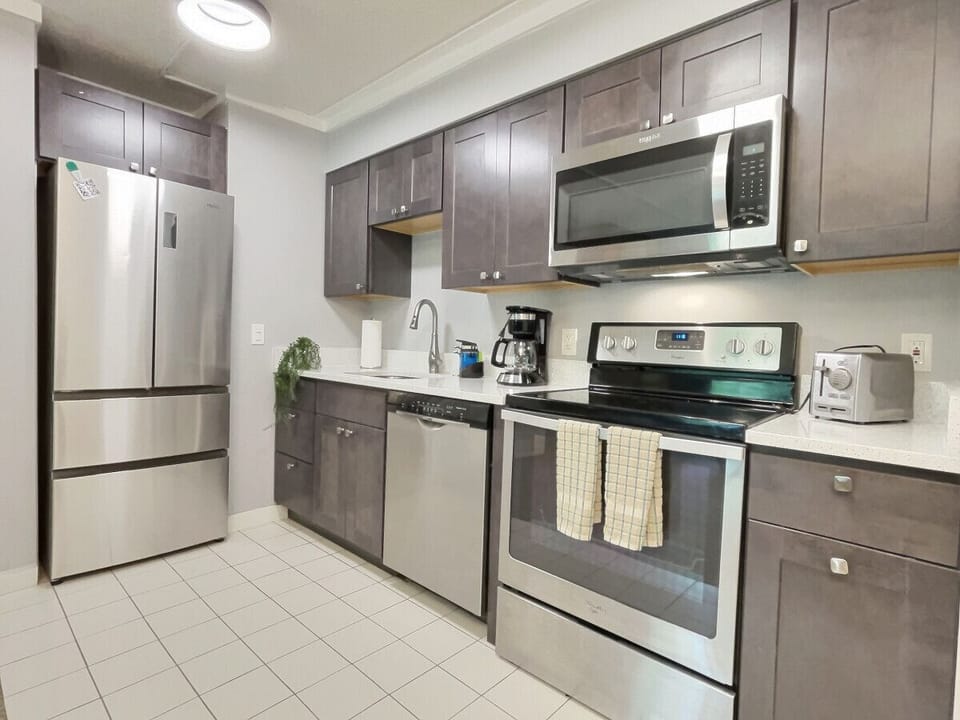 Bright and spacious kitchen stocked with all appliances for a convenient stay.