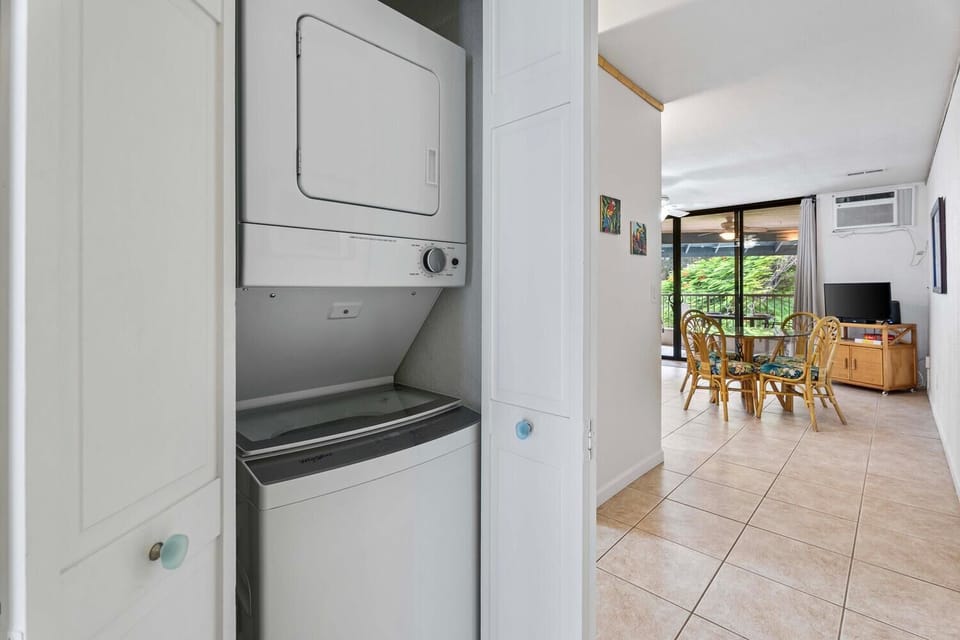 An in-unit laundry area with a washer and dryer for convenience.