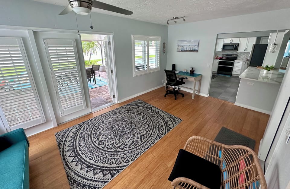 Sun room with French doors to the patio and pool
