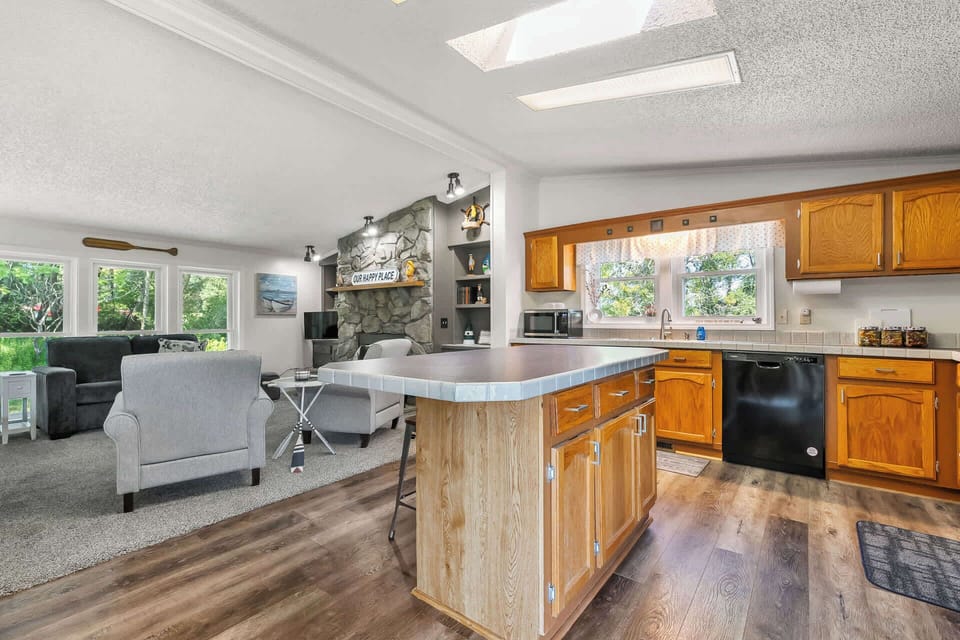 Kitchen over looks living room with smart TV