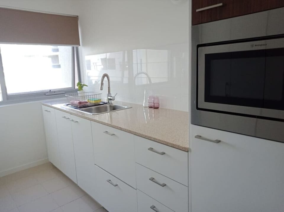 Cook in style with our fully equipped modern kitchen, featuring high-end appliances, ample counter space, and everything you need for delicious meals.