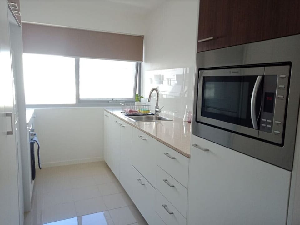 Cook in style with our fully equipped modern kitchen, featuring high-end appliances, ample counter space, and everything you need for delicious meals.
