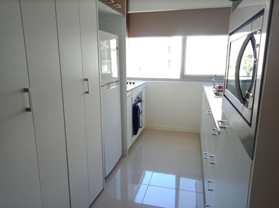 Cook in style with our fully equipped modern kitchen, featuring high-end appliances, ample counter space, and everything you need for delicious meals.