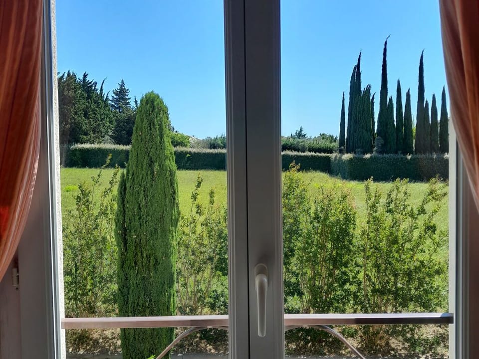 Green lawns and towering cypress trees fill the view right outside the window—you'll love it.
