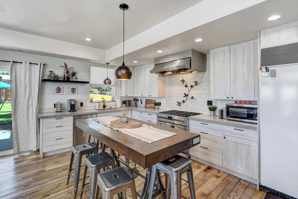 Prepare and enjoy meals in this stylish kitchen, fully equipped for your convenience.