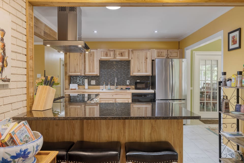 Barstool seating near the kitchen.