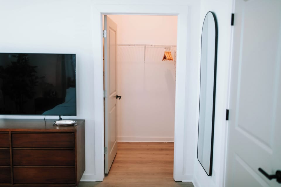 We have a spacious walk-in closet with storage for all your belongings. It comes equipped w/  hangers & plenty of room to organize your wardrobe. A full-length mirror is conveniently placed making it easy to get ready for any occasion.
