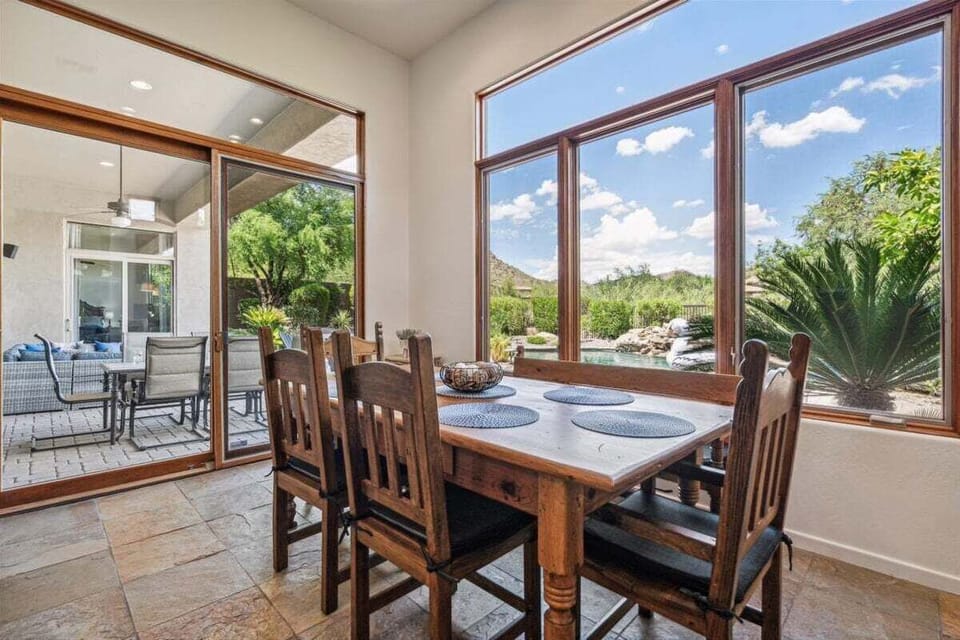 Dining table next to the kitchen that seats 6 guests.
