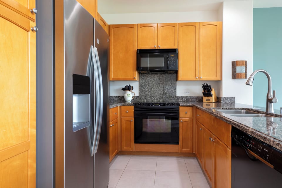 Full kitchen with granite countertops and modern appliances