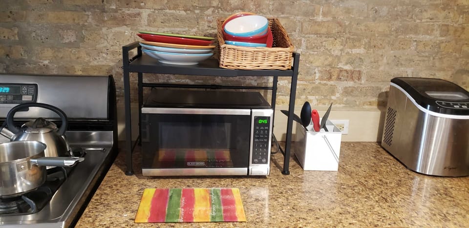 Full size stove/oven with above stove exhaust fan, Microwave, counter ice maker