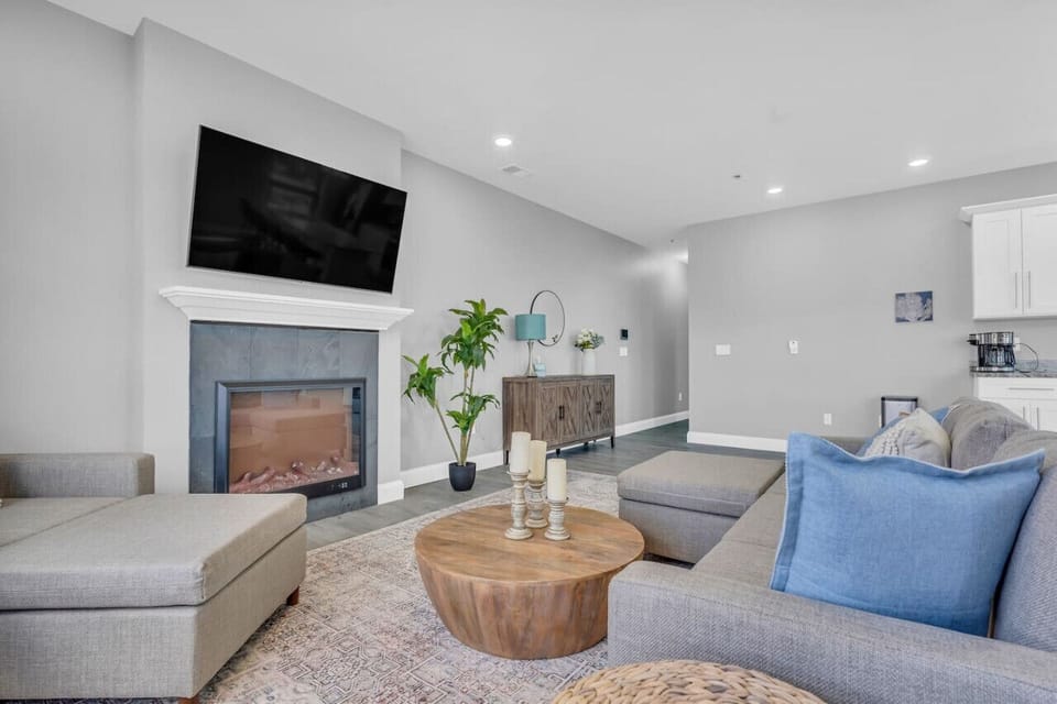 Large TV above the fireplace to catch a flick when the weather isn`t cooperating