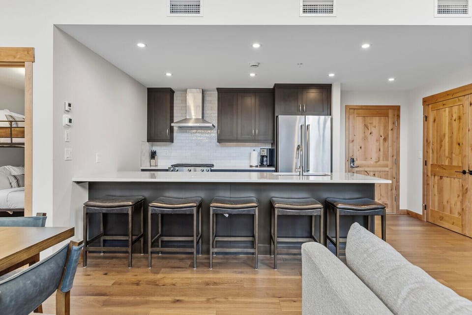 Beautiful modern kitchen, fully stocked for cooking and ample seating to entertain