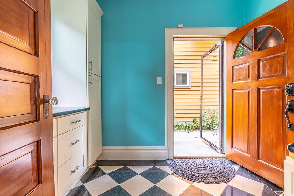 Back door of the house is used as main entrance.  This door has coded lock. 