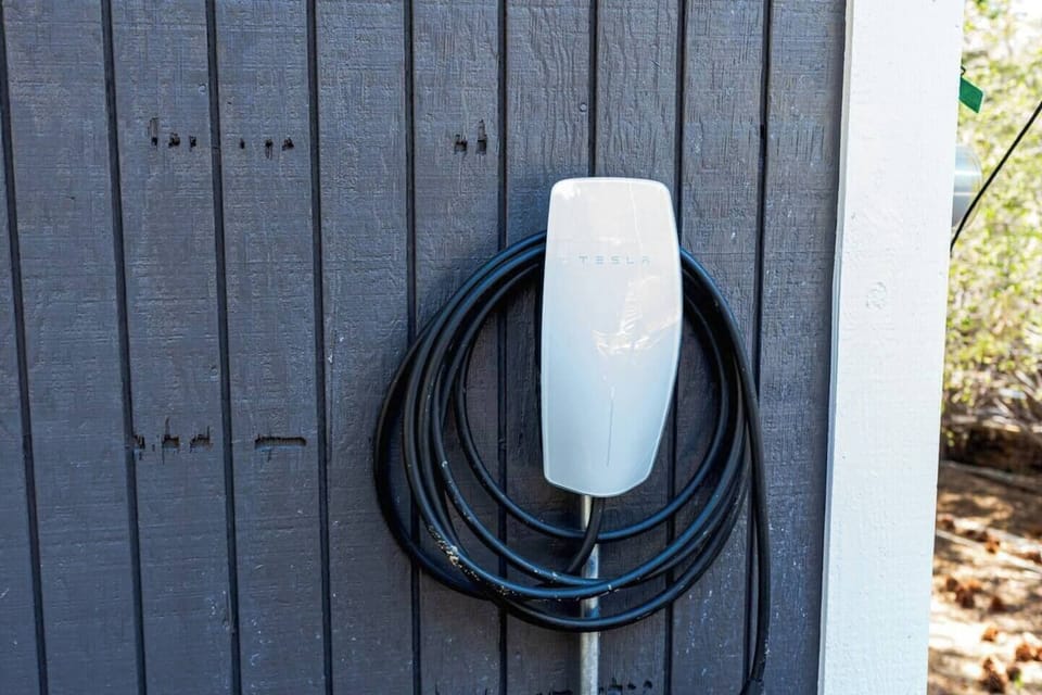 On sight complimentary electric charging. Tesla with j1772 adapter to fit most other cars