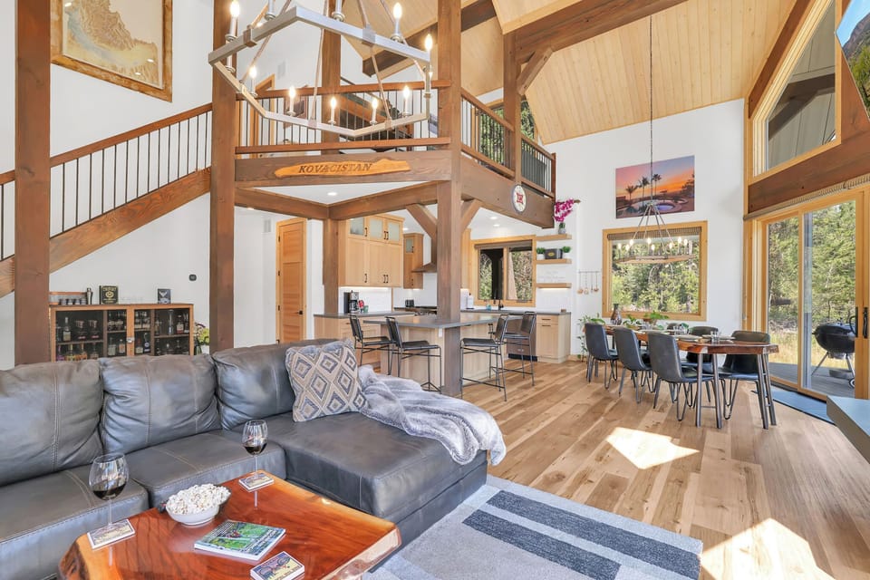 The open concept space is perfect for entertaining, including the loft space featuring two solid wood built-in bunks