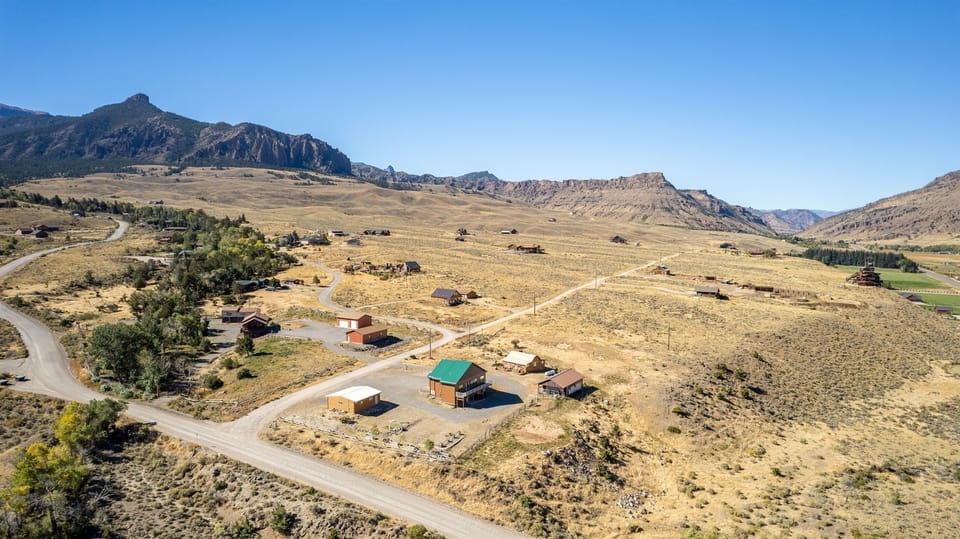 Charming cabin surrounded by breathtaking mountain views, offering a peaceful retreat with nature all around, perfect for a serene getaway in the heart of Wyoming.