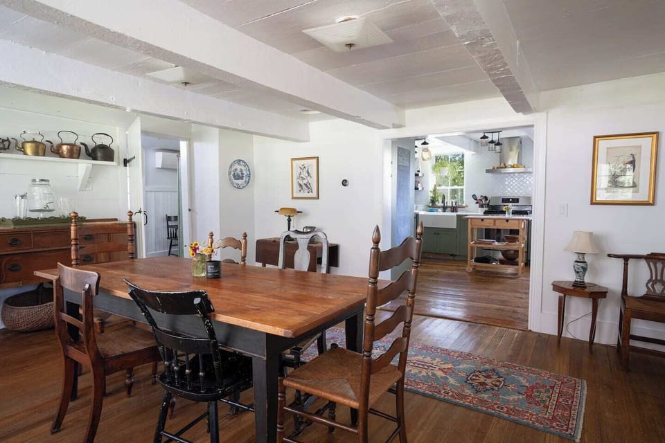Dining room is adjacent to the kitchen, living room, main entrance & deck