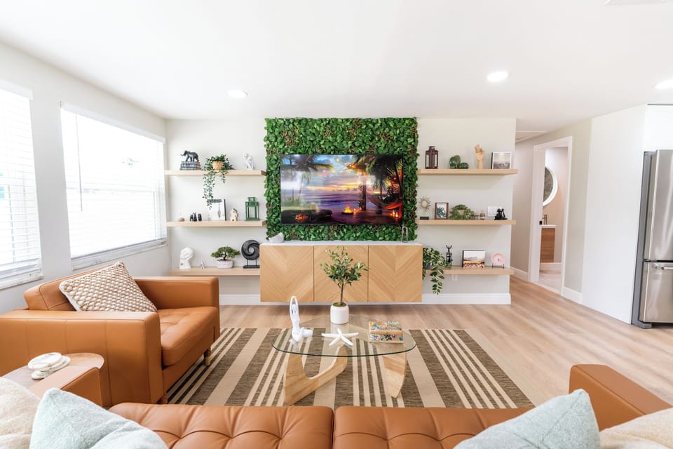 Bright living room with 65 inch Smart TV.