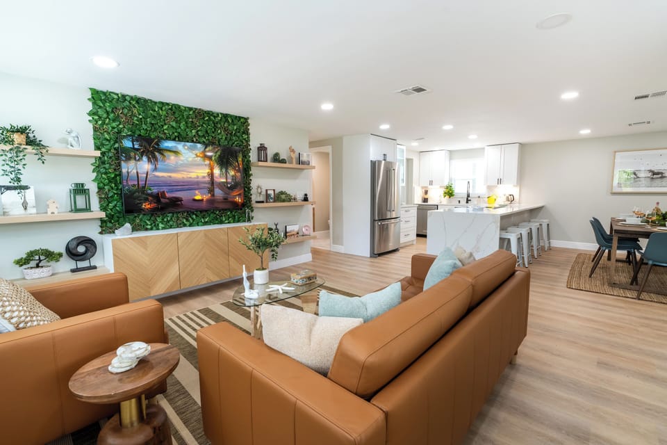 Bright living room with a 65 inch smart TV.