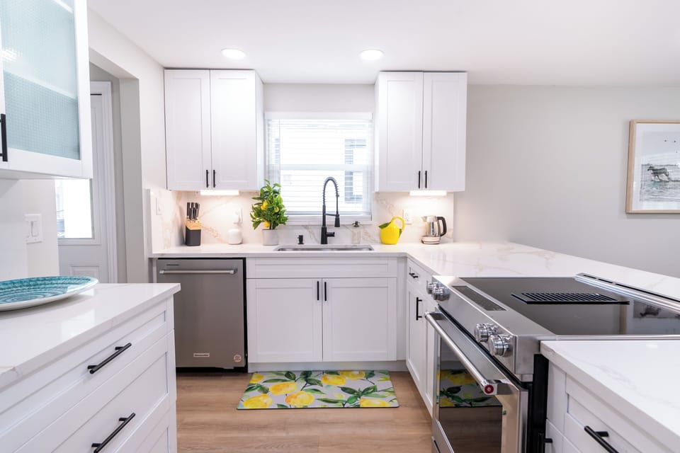 Newly renovated kitchen with top of the line appliances and seating. 