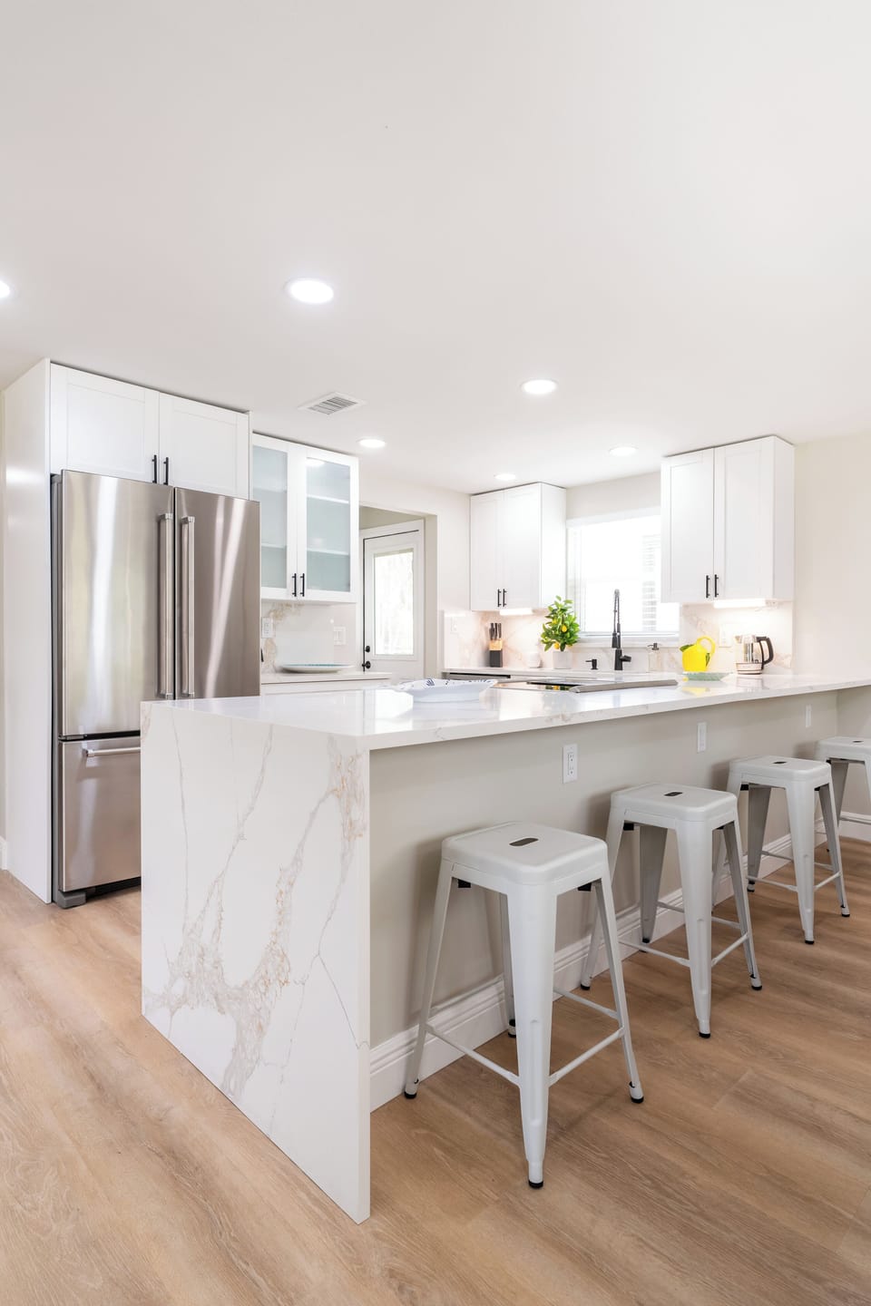 Newly renovated kitchen with top of the line appliances and seating. 