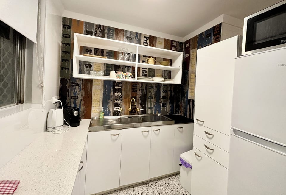 Kitchen with coffee espresso maker