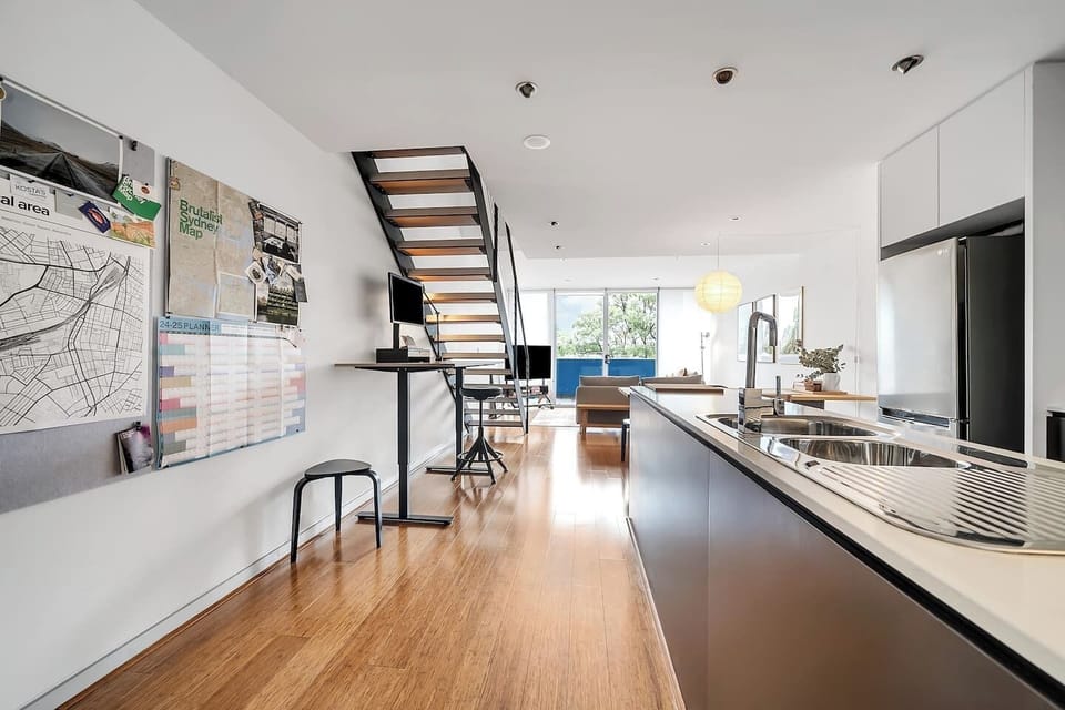 This stylish apartment features an open-plan design on the lower level with the bedrooms located upstairs.
