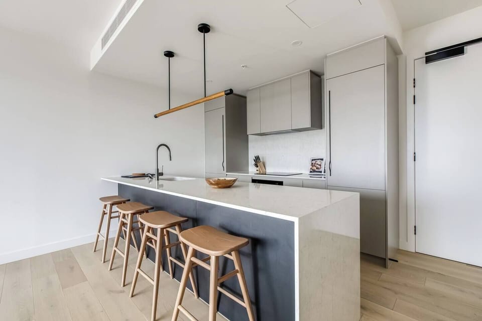  The sleek kitchen comes fully equipped with high-quality appliances and cooking utensils for at-home meals
