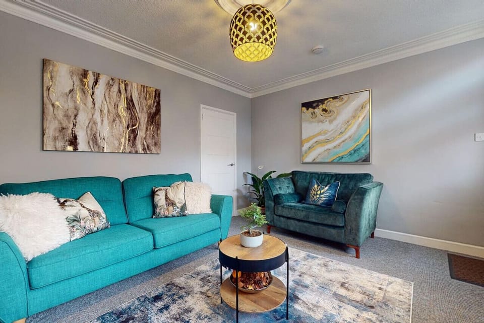 Discover the perfect blend of comfort and style in this inviting living room. The cozy couch, elegant coffee table, and modern television create an ideal space for relaxation and entertainment. 🛋️📺 #HomeSweetHome #LivingRoomGoals #InteriorDesign