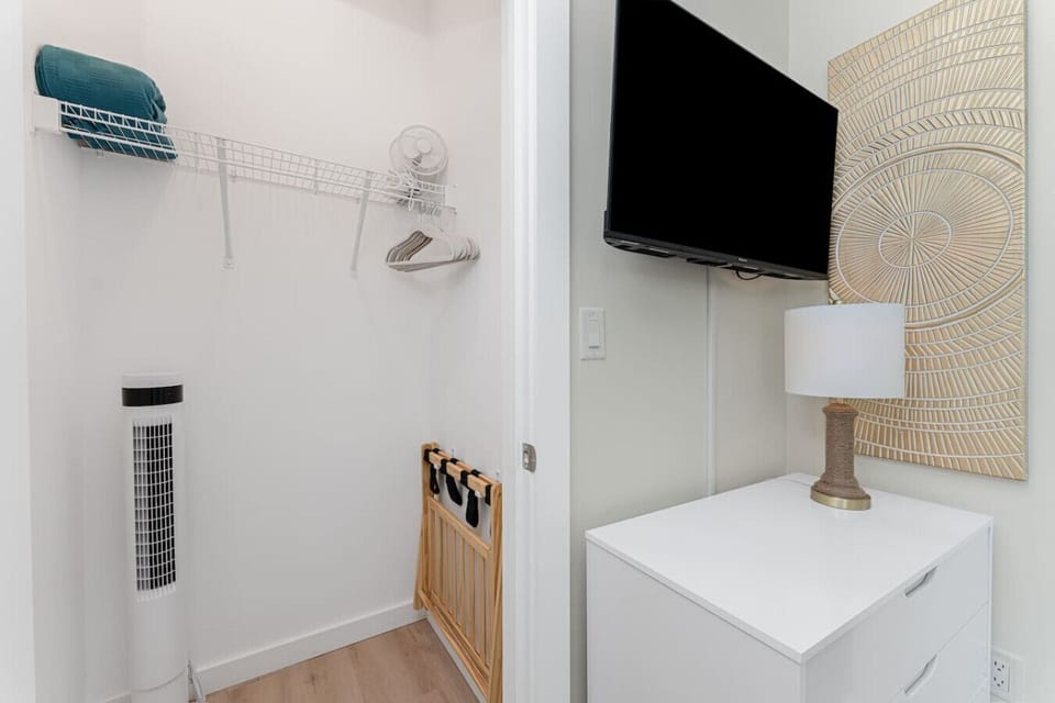 Bedroom Two has Walk-In Closet with Luggage Rack, Tower Fan, Hangers and Extra Blanket
